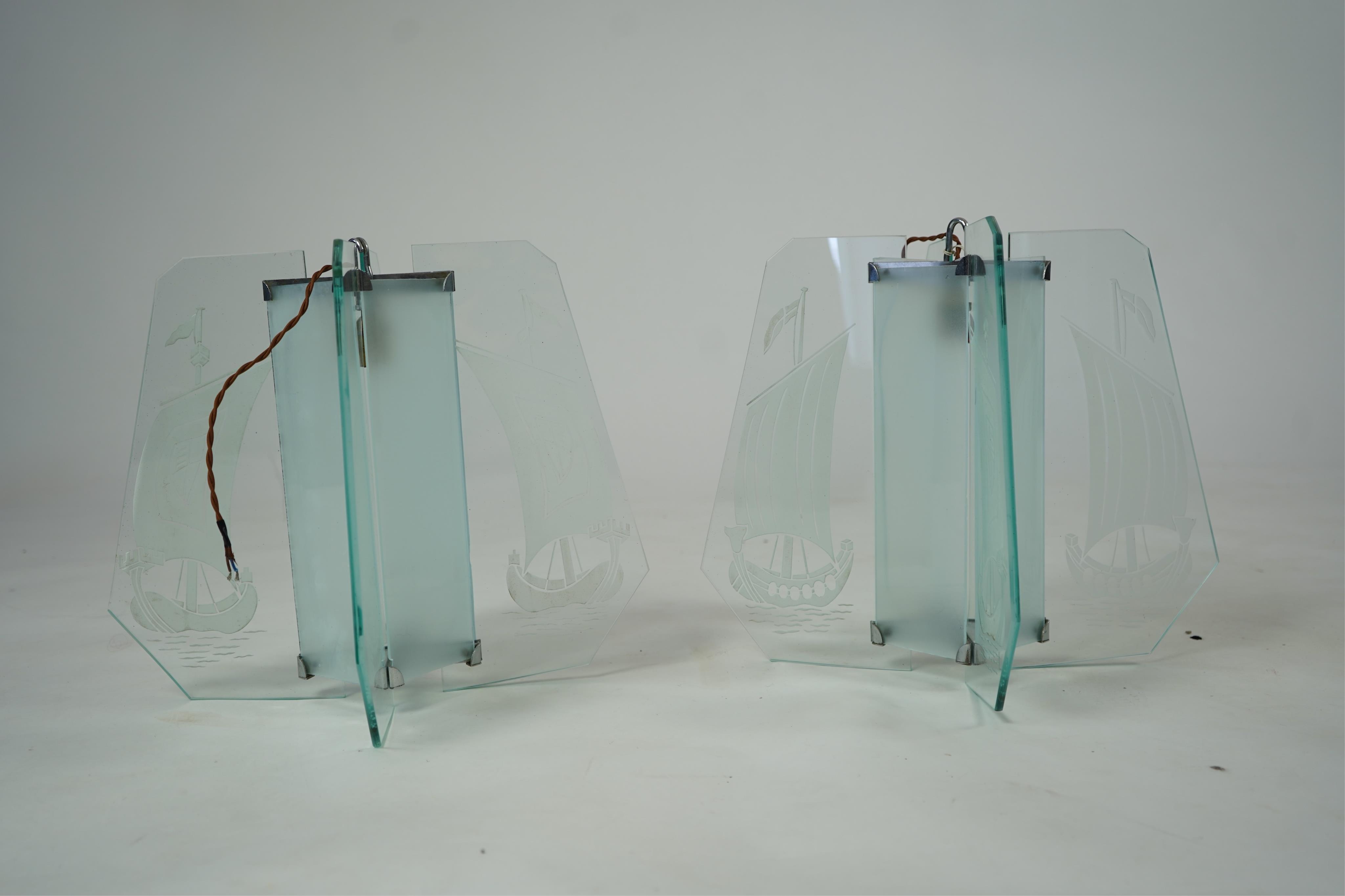 A pair of Art Deco chrome and four panelled etched glass ‘Galleon’ designed celling pendant lights